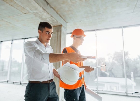 planning the process man in suit and handyman